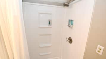 Bathtub, hair dryer, towels