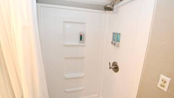 Bathtub, hair dryer, towels