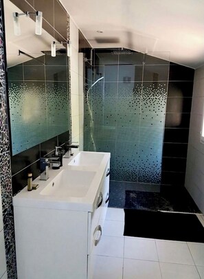 Shower, hair dryer, towels, soap