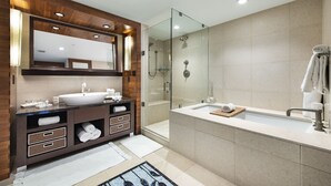 A modern bathroom with a large mirror, a sink, a shower, and a bathtub. - Large 2 BR 2 BA Apartment at The Carillon Wellness Resort (Miami Beach)