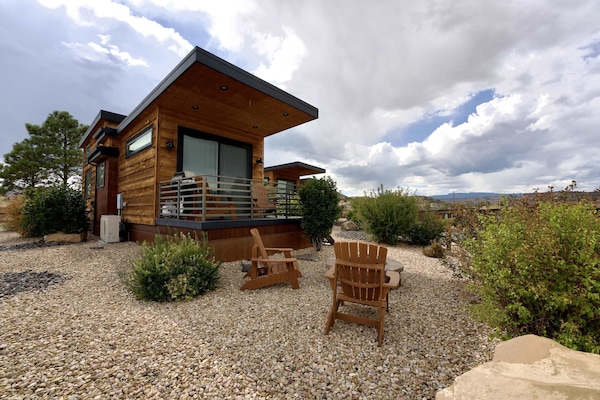 Fox Tail at Escalante Escapes is a luxurious tiny home that is perfect for a romantic getaway, a family vacation, or a solo retreat!