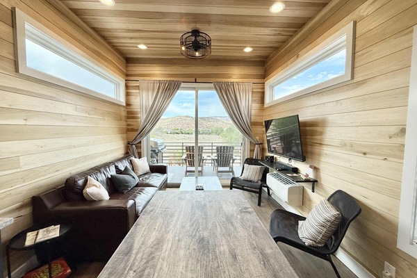 How big is 400 square feet? Bigger than you imagine! The living room in this tiny home is cozy and inviting, with plenty of seating for everyone to relax and socialize. At night, you can open the sofa up to have a queen-size sleeper.