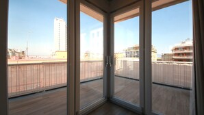 A corner room with large glass doors leading to an outdoor balcony. - SUITE WITH VESUVIUS VIEW TERRACE IN HISTORIC CENTER (Napoli)