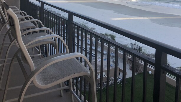 A balcony with a view of the beach and ocean. - Oceanfront  Sandcastle Condo, South #506 (Ponce Inlet)