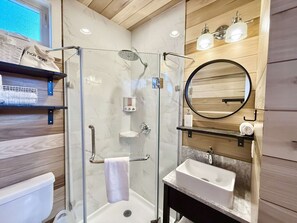 Shower, hair dryer, towels, shampoo