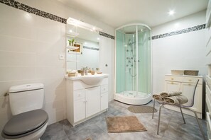 Shower, hair dryer, towels, soap