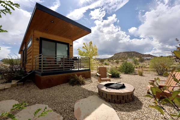 The back porch offers seating, a propane grill and incredible high desert views!