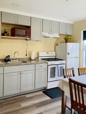 Fridge, microwave, oven, cookware/dishes/utensils