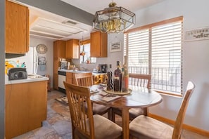 Enjoy meals in the spacious kitchen and dining area, featuring an oven and sink.