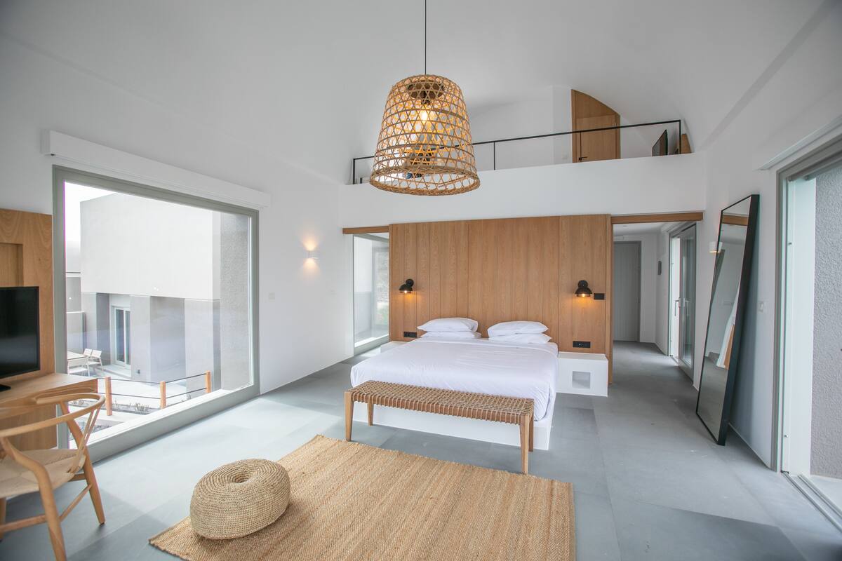 superior suite with loft with caldera view and private pool | living area | smart tv