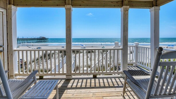 A covered porch with a view of the beach and pier. - Against The Wind Side B, Oceanfront Home, Awesome view of Garden City Pier (Garden City Beach)