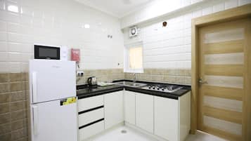Fridge, microwave, electric kettle, cookware/dishes/utensils