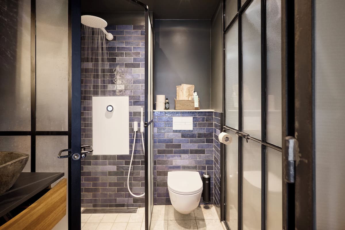 Shower, designer toiletries, hair dryer, towels