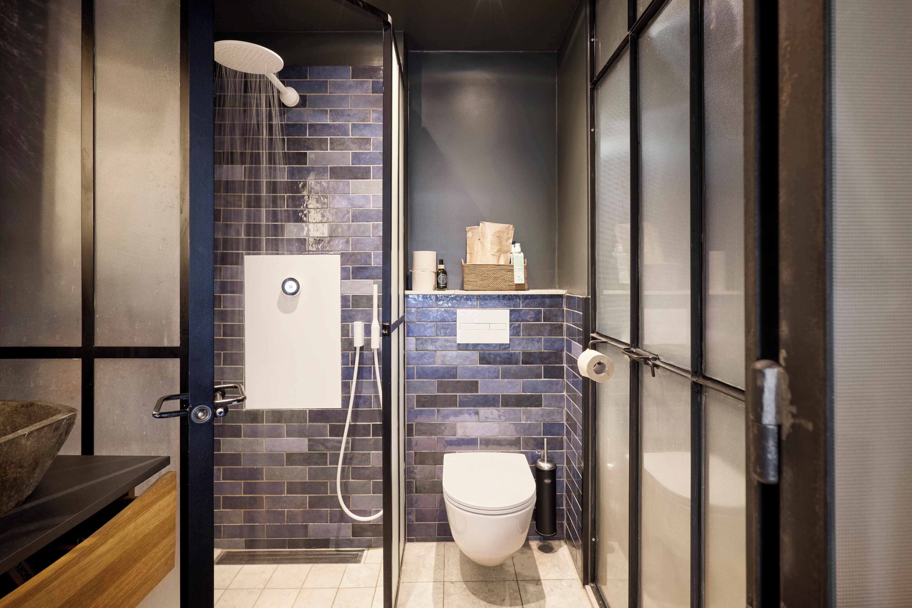 Shower, designer toiletries, hair dryer, towels