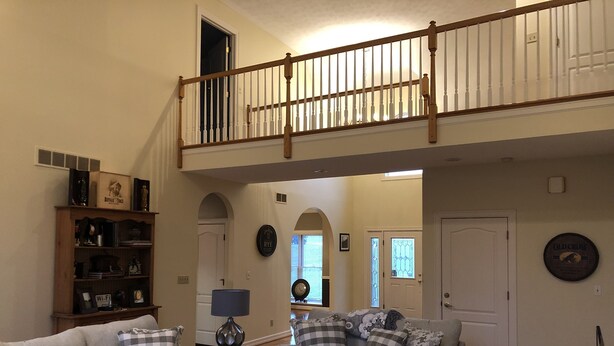A spacious living room with two grey sofas, a wooden bookshelf, and a staircase leading to an upper level. - H-DERBY, Keeneland, Bourbon or Family Gathering!  (Frankfort)