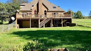 A two-story house with a large deck, a covered patio, and a garage. - H-DERBY, Keeneland, Bourbon or Family Gathering!  (Frankfort)