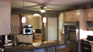 A kitchen with granite countertops, stainless steel appliances, and wooden cabinets. - H-DERBY, Keeneland, Bourbon or Family Gathering!  (Frankfort)
