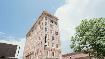 Stunning historic building with a classic facade, featuring evenly spaced windows and decorative elements.