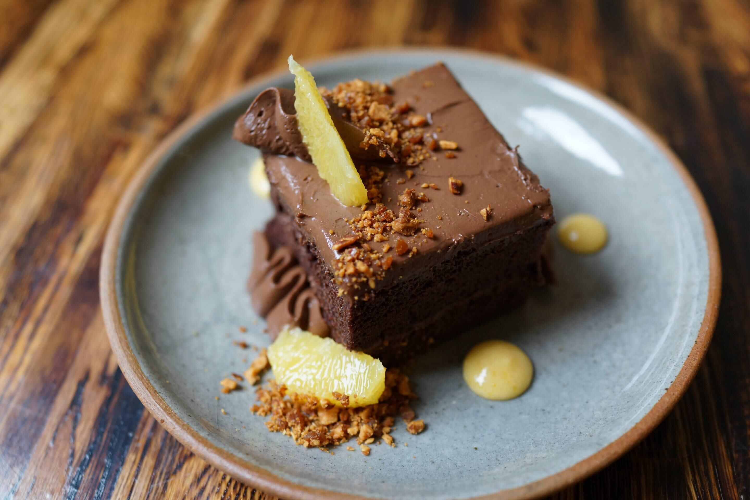 A dessert on a plate with a wooden table background.