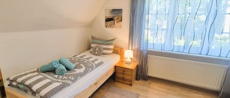 2 habitaciones, tabla de planchar con plancha, cuna de viaje y wifi