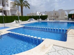 Outdoor pool, open 9:00 AM to 9:00 PM, pool umbrellas