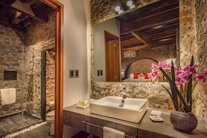 Suite, 1 King Bed | Bathroom | Separate bathtub and shower, free toiletries, hair dryer, slippers
