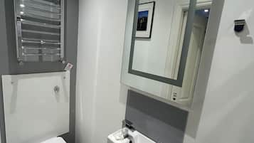 Shower, towels, toilet paper