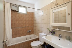 Designer toiletries, hair dryer, towels