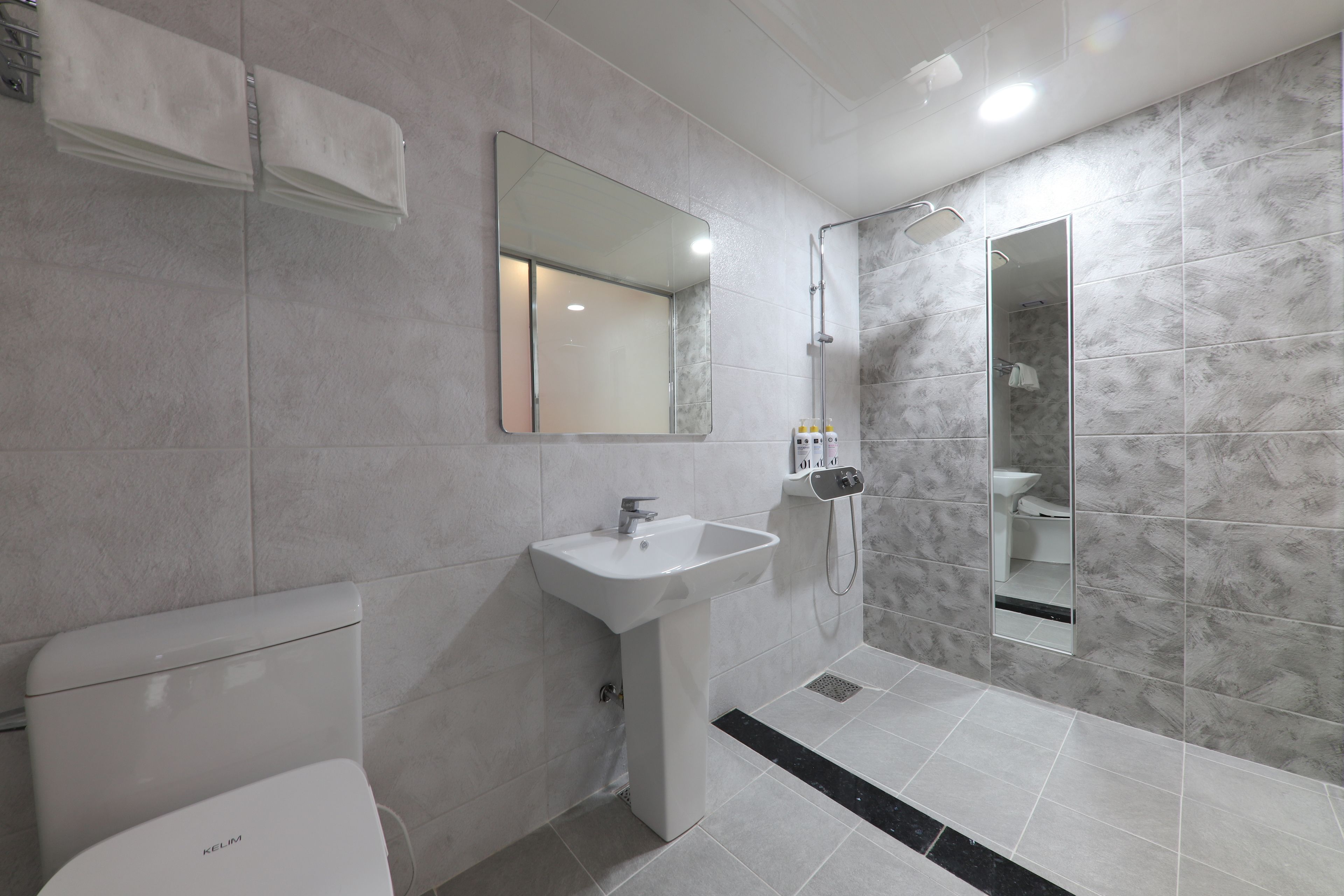 hair dryer, bathrobes, slippers, towels