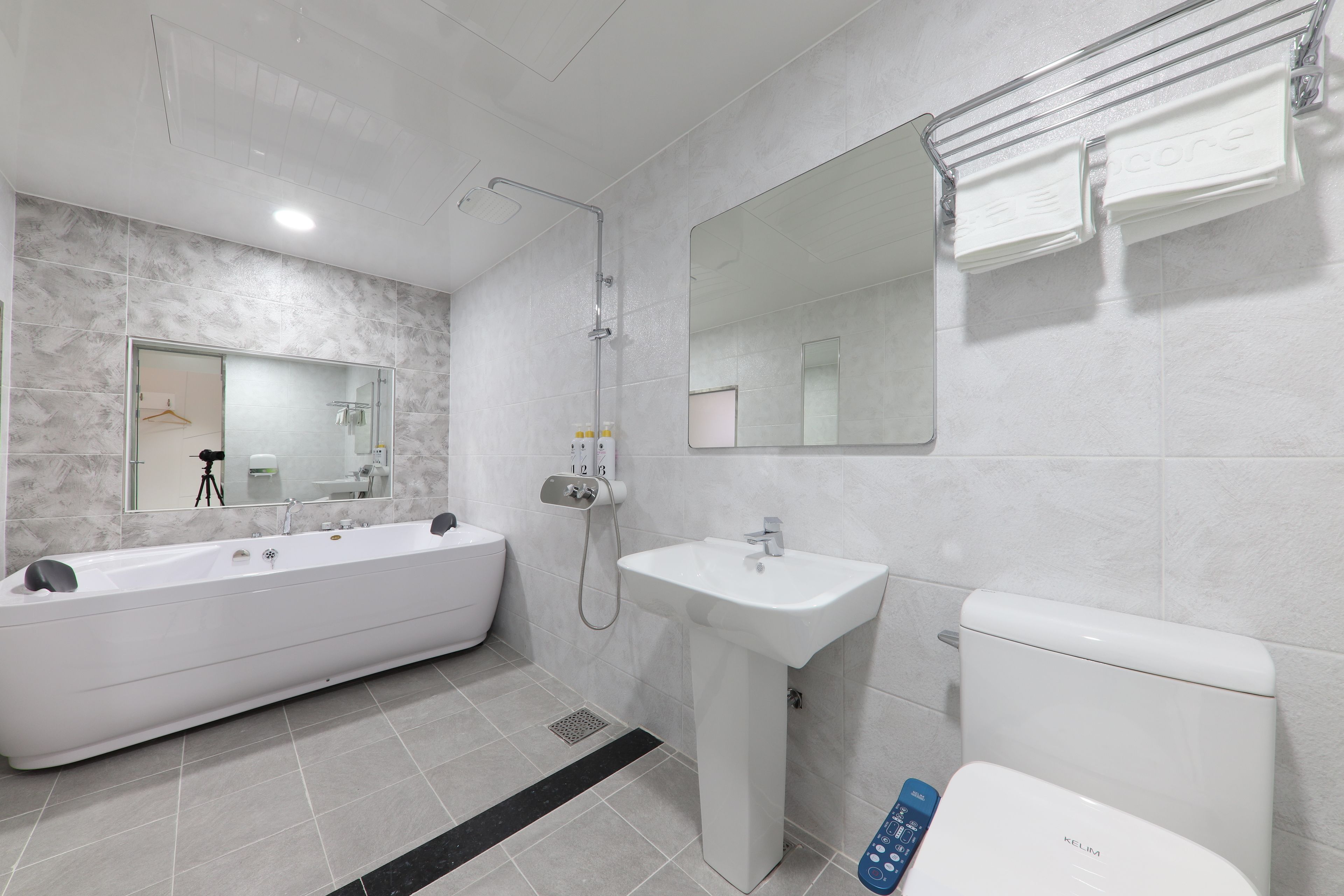 family room, jetted tub | bathroom | hair dryer, bathrobes, slippers, towels