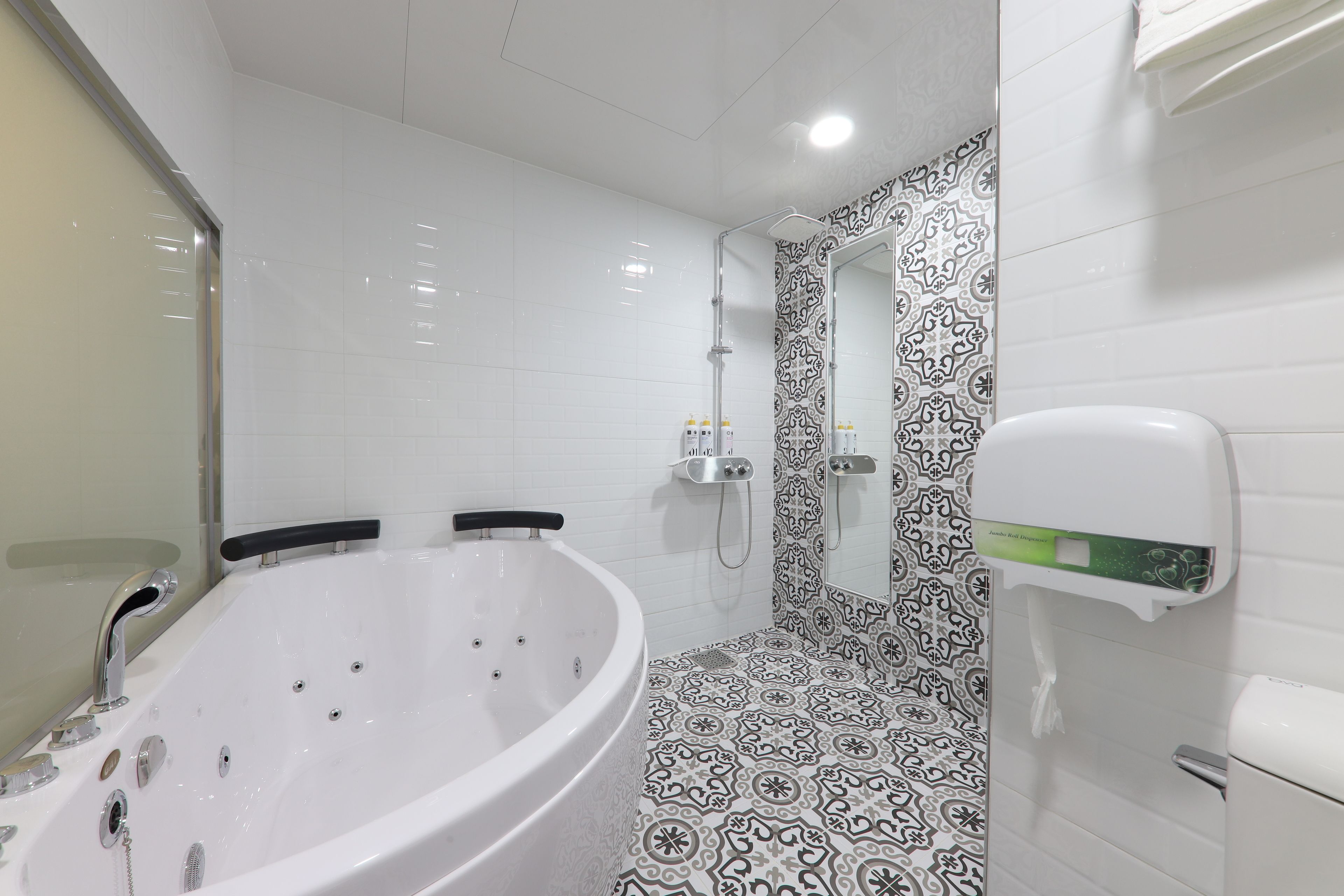 deluxe room, jetted tub (vip) | bathroom | hair dryer, bathrobes, slippers, towels