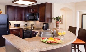 Microwave, dishwasher, coffee/tea maker, cookware/dishes/utensils