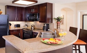 Microwave, dishwasher, coffee/tea maker, cookware/dishes/utensils