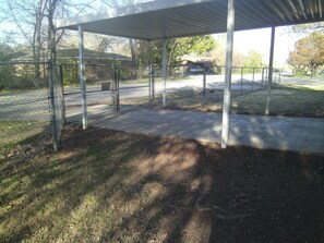 Relax in a tranquil outdoor space surrounded by trees and grass.