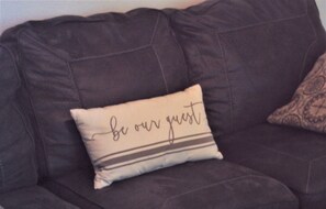 Relax on the sofa with a warm invitation to unwind.