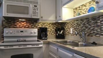 Coffee/tea maker, fridge, microwave, oven