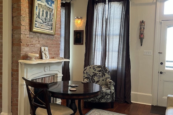 Entry area left side parlor relaxation area.Table chair and ccouch. Relax here!