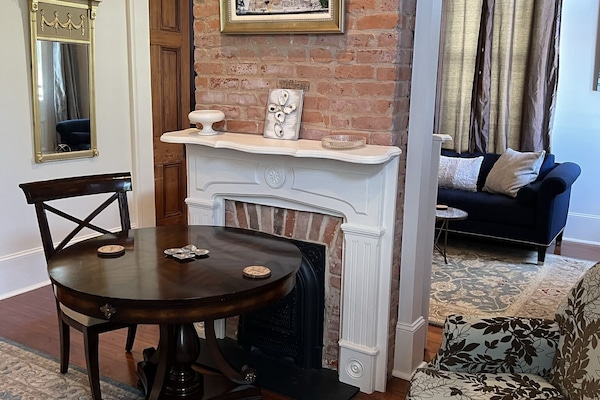 Entry of home, double parlor left side. Table Chairs & sofa. Privacy room, relax