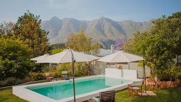 Seasonal outdoor pool, pool umbrellas