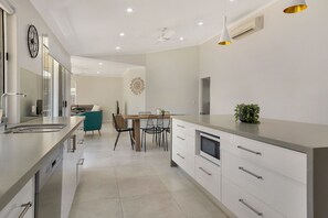 Deluxe House, 4 Bedrooms, Pool View | Private kitchen | Full-size fridge, microwave, oven, stovetop - Experience a Luxurious and Private Getaway (Noosaville)