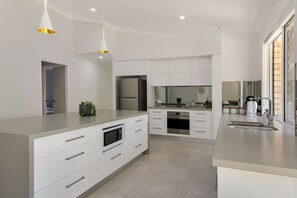 Deluxe House, 4 Bedrooms, Pool View | Private kitchen | Full-size fridge, microwave, oven, stovetop - Experience a Luxurious and Private Getaway (Noosaville)