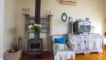 Deluxe House, 3 Bedrooms | Living area | LED TV, fireplace