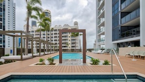 Outdoor pool, pool loungers - Resort Style Pad by the Beach (Broadbeach)