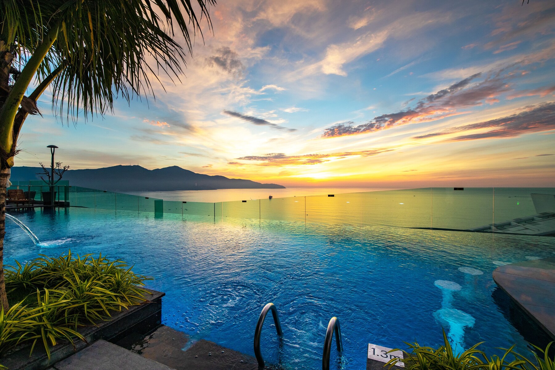 Outdoor pool, open 7:00 AM to 8:00 PM, pool umbrellas, pool loungers