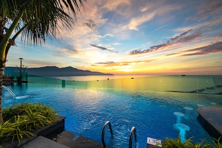 Outdoor pool, open 7:00 AM to 8:00 PM, pool umbrellas, sun loungers