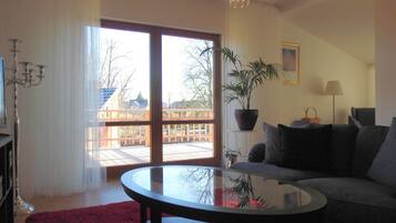 Luxury Apartment, Balcony, Garden View | Living room | Flat-screen TV