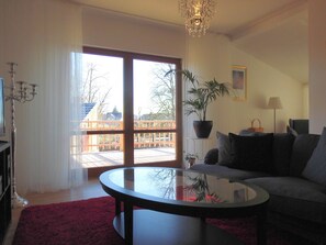 Luxury Apartment, Balcony, Garden View | Living room | Flat-screen TV