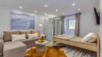 Apartment, Ground Floor (Small, sweet & cosy 1) | Living area | Flat-screen TV