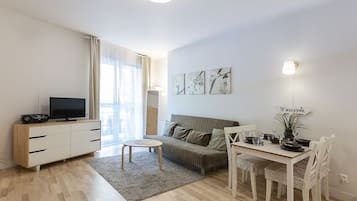 Baltycka 10 Apartament 9 | Living area | Flat-screen TV