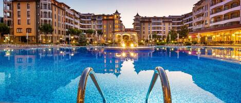 Seasonal outdoor pool, open 9:00 AM to 6:00 PM, pool umbrellas